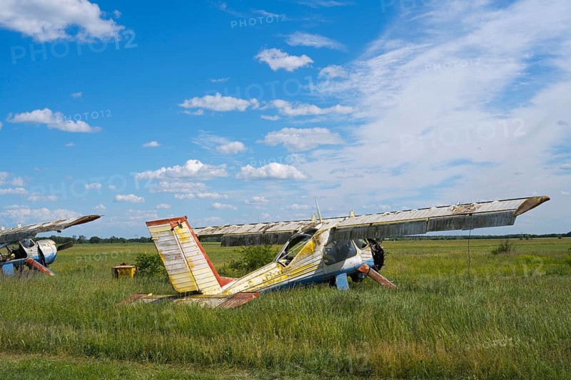 Disintegrated aircraft on a wide field under a slightly cloudy sky, multi-purpose aircraft evom type PZL-104 Wilga, abandoned airport, Ceadir-Lunga, Ceadîr-Lunga, Chadyr-Lunga, Taraclia district, Gagauzia autonomous region, Republic of Moldova, Moldova