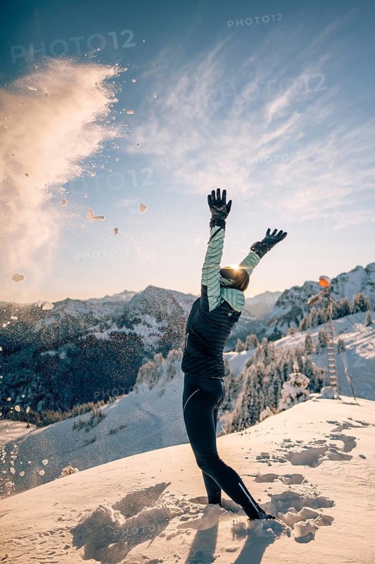 Summit bliss in the snow-covered winter landscape in the Tannheimer Tal in the Alps on the Neunerköpfle, Tyrol, Austria