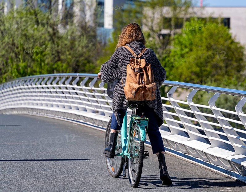 Pedestrians and cyclists on Kronzprinzenbrücke, Regierungsviertel Berlin, Germany