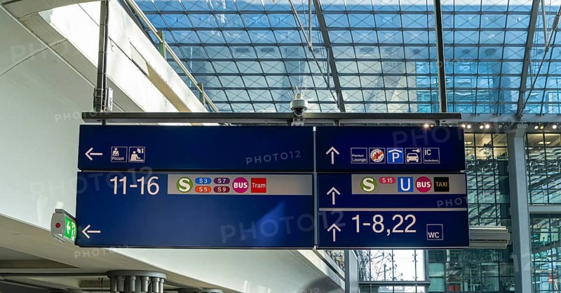 Everyday scenes, travelers and railway employees as well as the interior design, signs, signposts and the DB travel center, in and at Berlin Central Station, Germany