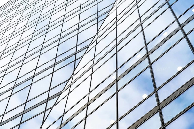 Abstract concept architectural detail of a corporate office building in the financial district of the British capital, London, centre of European investment and banking Industry
