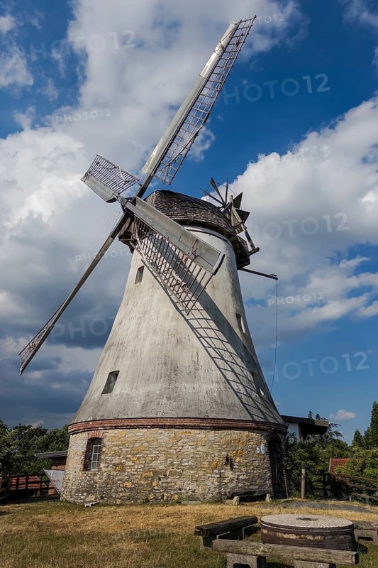 Historic windmill with mill wheel in Lechtingen, Wallenhorst, Lower Saxony, Germany