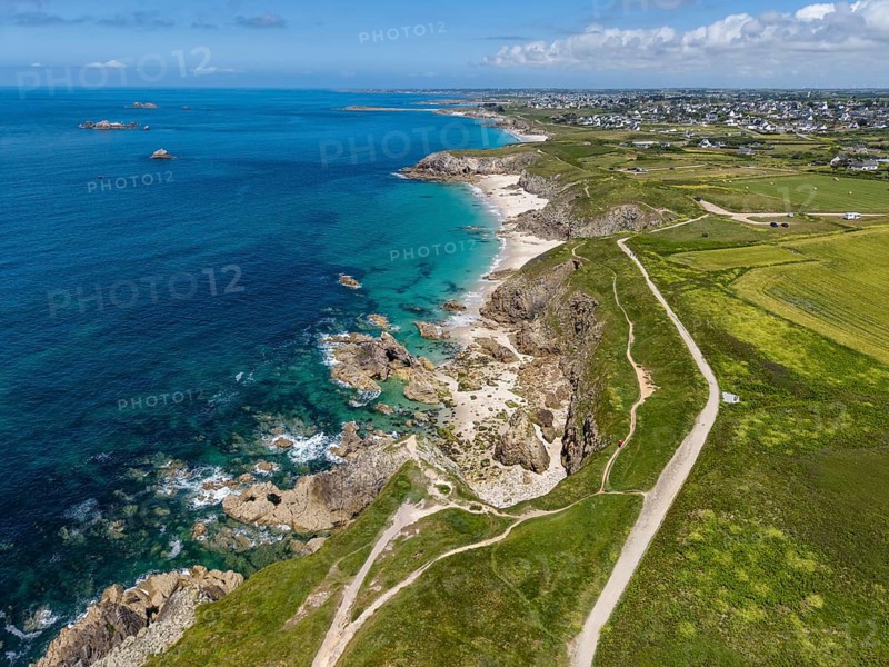 Aerial view of the sandy beach, Plage des Charettes beach north of Pointe Corsen, a cape at the westernmost point of continental France on the Breton coast, on the horizon the village of Kervilon, Commune of Plouarzel, Finistère, Brittany, France