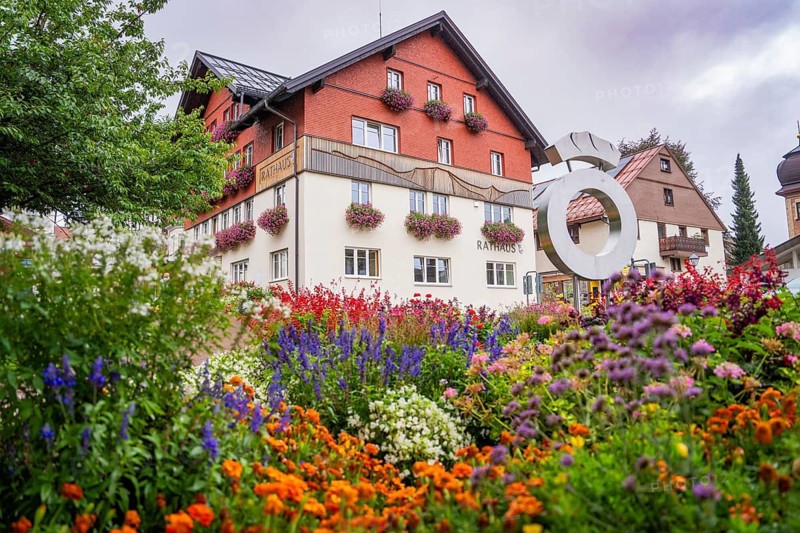 Beautiful flowers in front of the town hall in an idyllic setting, Oberstaufen, Allgäu, Bavaria, Germany