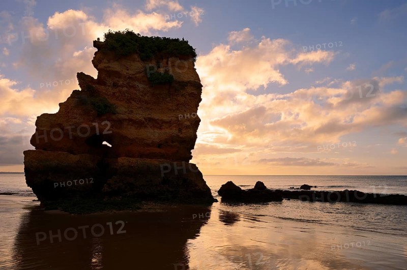 Rock formation on the coast at sunrise, Praia Dona Ana, Lagos, Algarve, Portugal