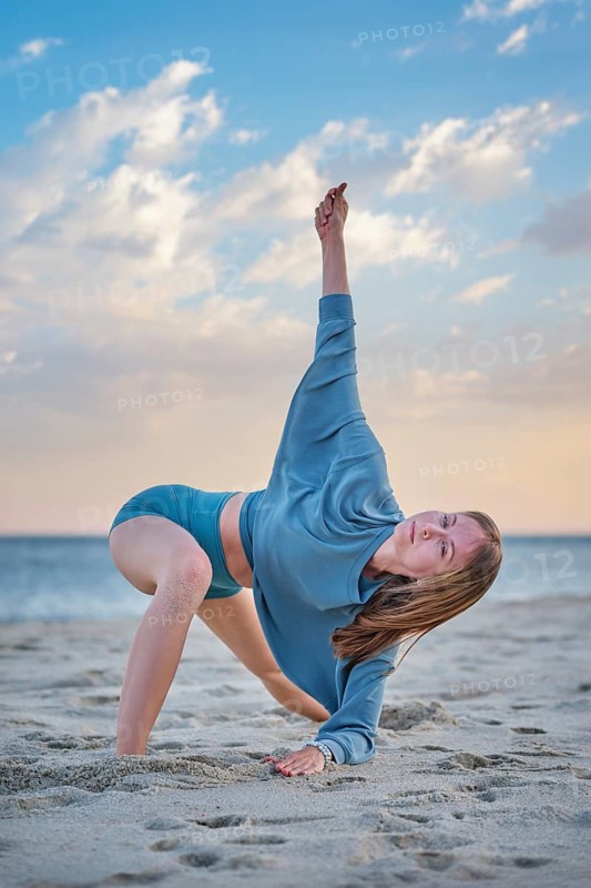 Scene featuring a young woman, camatkarasana, wild thing pose, a woman, yoga, yoga asana, and sunset