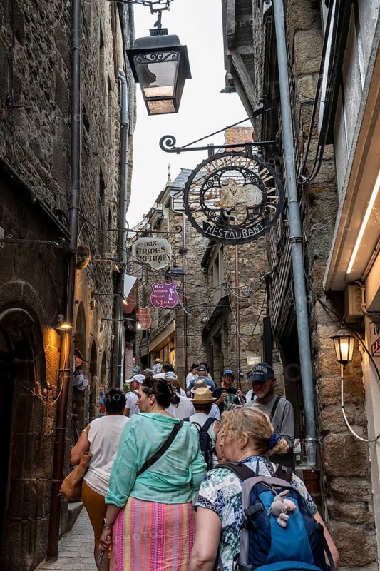 Mass tourism in the historic alleys of Rocky Island, Le Mont Saint Michel monastery island, tourist attraction, UNESCO World Heritage Site, Pontorson, Manche department, Normandy, France
