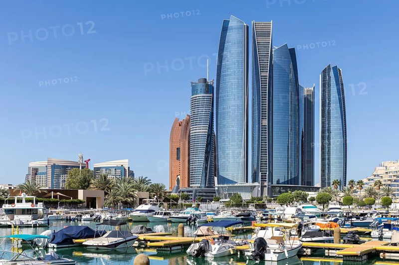 Abu Dhabi Skyline Etihad Towers skyscrapers with marina yacht harbor in Abu Dhabi, United Arab Emirates
