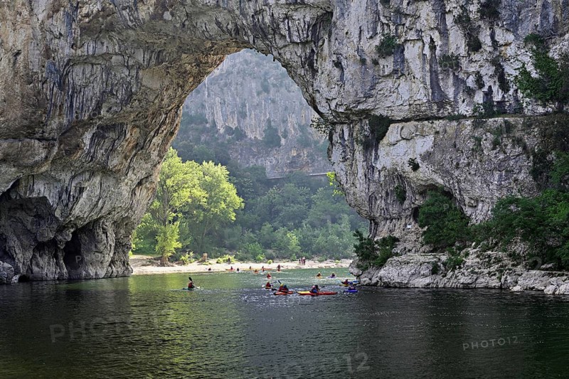 Canoes on the Ardèche river, above the Pont d'Arc rock gate, Ardèche Gorge, Gorges de l'Ardèche, Vallon-Pont-d'Arc, Rhône-Alpes, France