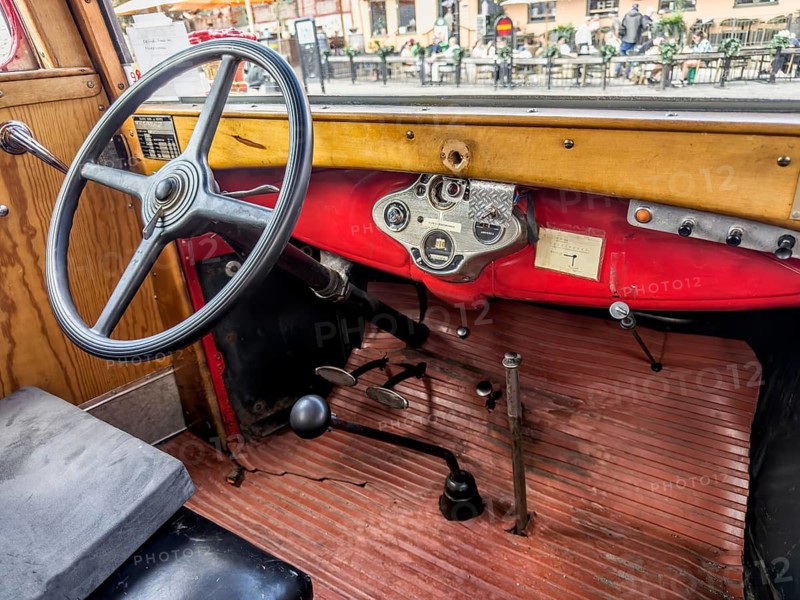 Interior of a 1931 Ford truck, featuring the steering wheel and dashboard. The vehicle currently serves as a vintage fire truck in Ystad, Skåne County, Sweden, Scandinavia
