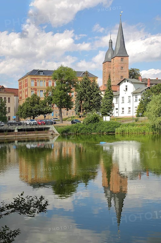 Red peaks with reflection in the small pond, landmark, double towers, cityscape, Altenburg, Thuringia, Germany