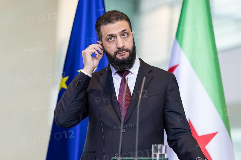 Ahmed al-Sharaa (President of the Syrian Arab Republic) at a joint press conference with Friedrich Merz (Chancellor of the Federal Republic of Germany, CDU) after a one-on-one meeting at the Federal Chancellery, Berlin, 30 March 2026
