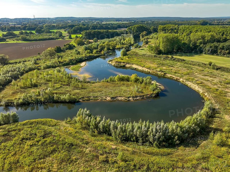 Datteln, North Rhine-Westphalia, Germany - Lippe, river and floodplain development of the Lippe near Haus Vogelsang, a near-natural river landscape was created here, an intact river-floodplain ecosystem restored with flood protection through redesigned flooded areas. The new Lippe-Schleife has created an extensive floodplain landscape that provides valuable habitat for animal and plant species