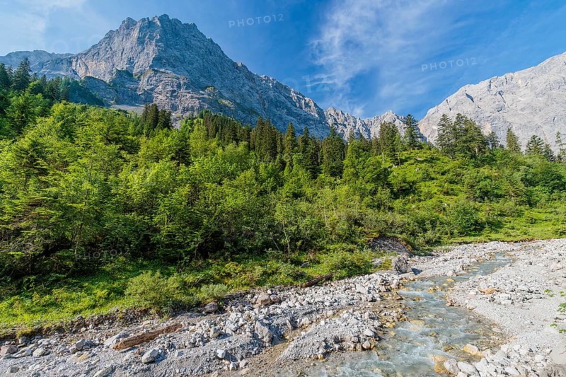 Enger Grund Creek in the Grosser Ahornboden Nature conservancy area on a sunny day. Eng valley, Tyrol, Karwendel mountains, Austria