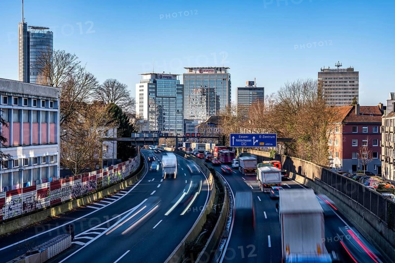 The A40 motorway, Ruhrschnellweg, in Essen, city skyline, Evonik office building, traffic jam in the westbound lane, Duisburg, slow traffic, North Rhine-Westphalia, Germany