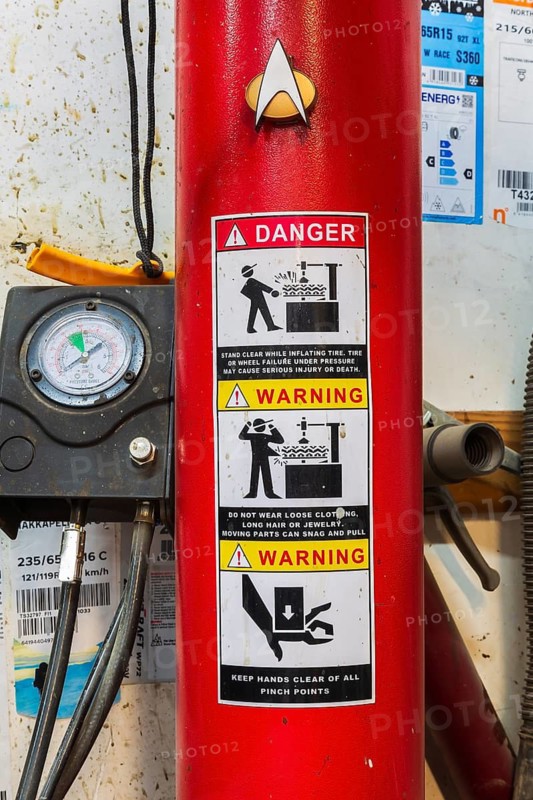 Pressure gauge, danger and warning label or sticker with pictogram safety instructiuons on RockSolid RSC4000 swing arm tire changer, Quebec, Canada