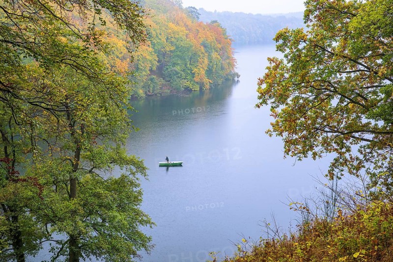 Canoeists on autumnal Schmale Luzin, lake in Mecklenburg-Western Pomerania, Feldberger Seenlandschaft, Mecklenburg-Western Pomerania, Germany