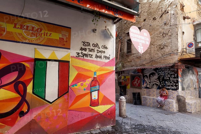 Bar on a street corner with painted Aperol advertising, street art in Quartieri Spagnoli, Spanish Quarter, Naples, Campania, Italy
