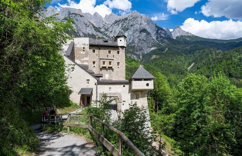 Footpath and entrance to Hohenwerfen Castle, behind the rocky peaks of the Tennengebirge, Werfen, Pongau, Salzburger Land, Austria