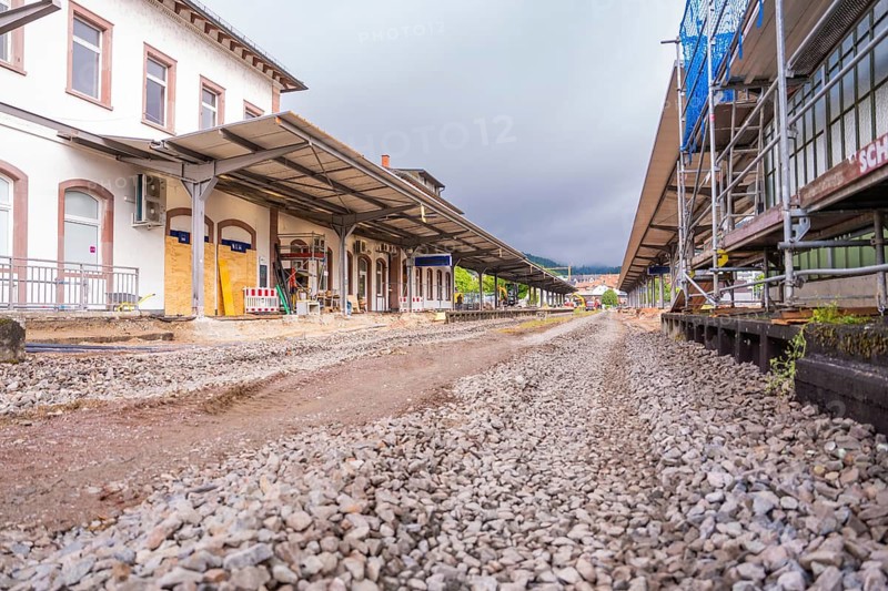 Station building under renovation with rubble path and roof, cloudy sky, station conversion electrification Leonhard Weiß, Waldshut. germany