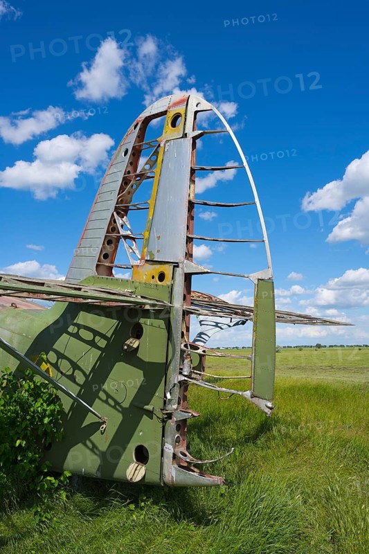 Airplane fin and metal structure in a field under clear blue sky, Antonov An-2 multi-purpose aircraft, biplane, abandoned airport, Ceadir-Lunga, Ceadîr-Lunga, Chadyr-Lunga, Taraclia district, Gagauzia autonomous region, Republic of Moldova, Moldova