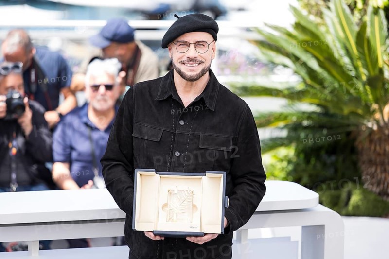John Travolta with the Golden Palm at the Propeller One-Way Night Coach photocall at the Palais des Festivals et des Congrès during the 79th Cannes International Film Festival. The 79th Cannes International Film Festival will take place from May 12 to 23, 2026