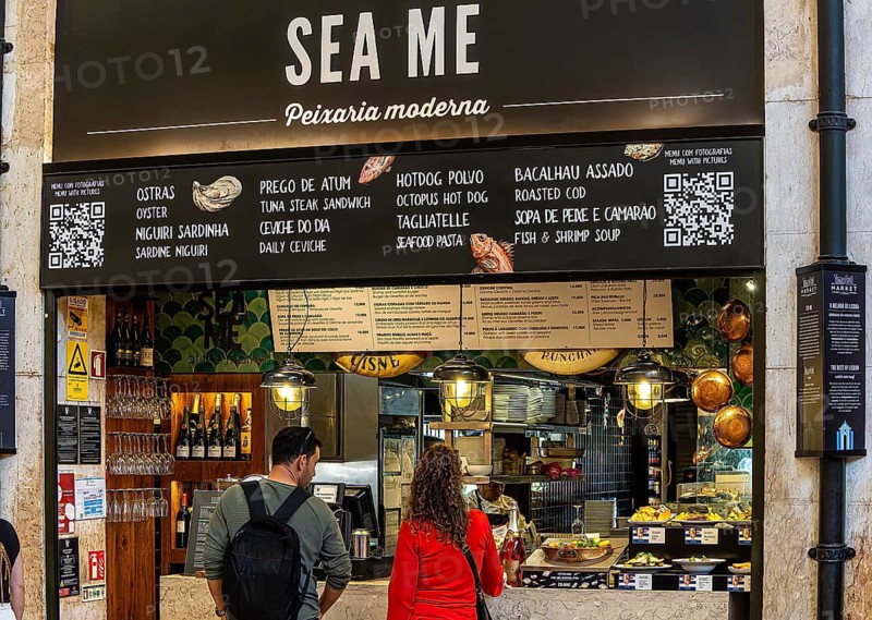 The Mercadeo da Ribeira, also known as TimeOut Market, is the best address for Portuguese specialties and international cuisine. Historic market hall at Cais do Sodré station, Lisbon, Portugal