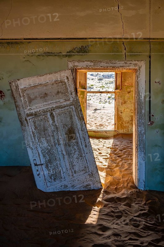 Interior view, doors and house full of sand, former diamond mining town, Namib Desert, Kolmanskop, Karas, Namibia