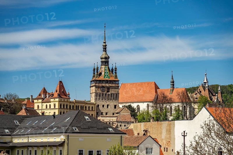 City view with hour tower and monastery church in Sighisoara or Sighisoara, Transylvania, Romania