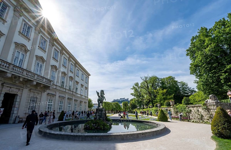 Mirabelle Garden with Pegasus Fountain and Mirabell Palace, Sun Star, Hohensalzburg Fortress in the back, Salzburg, Austria