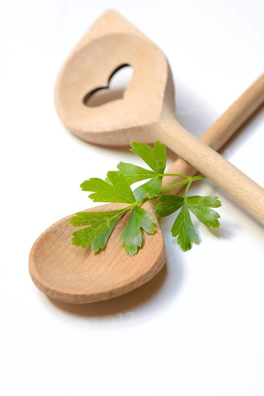 Cooking spoon and parsley, herb, Petroselinum crispum