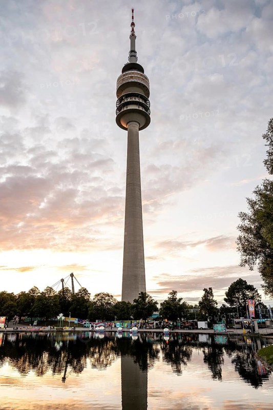 Olympic tower in front of Olympic Lake in the evening during the Superbloom Festival in Munich's Olympic Park on 29.08.2026