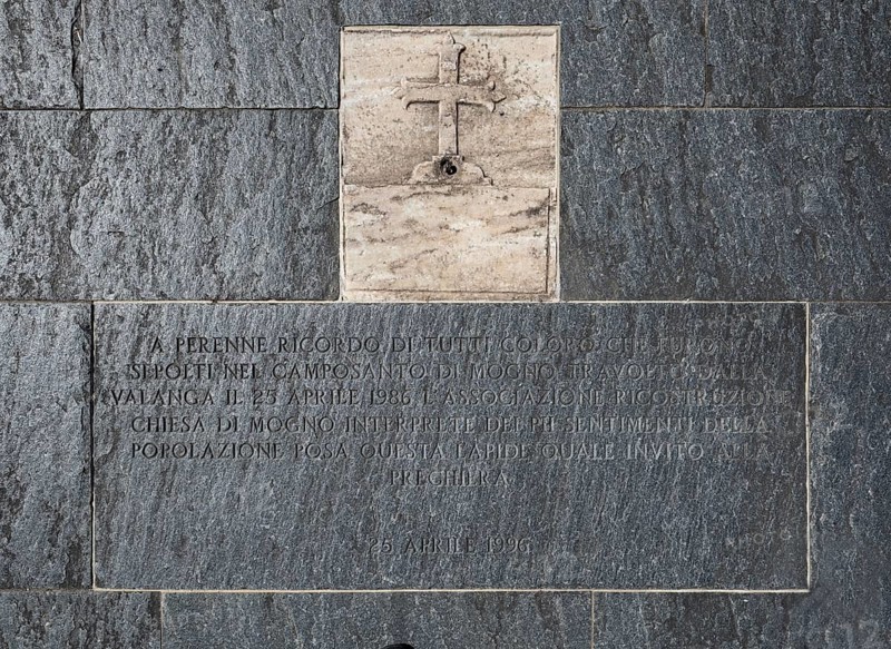 Memorial stone with an inscription in the entrance area of the Roman Catholic Church of San Giovanni Battista, built in the same place as the village church destroyed by an avalanche in 1986, architect Mario Botta, Mogno, Maggia Valley, Valle Maggia, municipality of Lavizzara, Canton of Tessin, Switzerland
