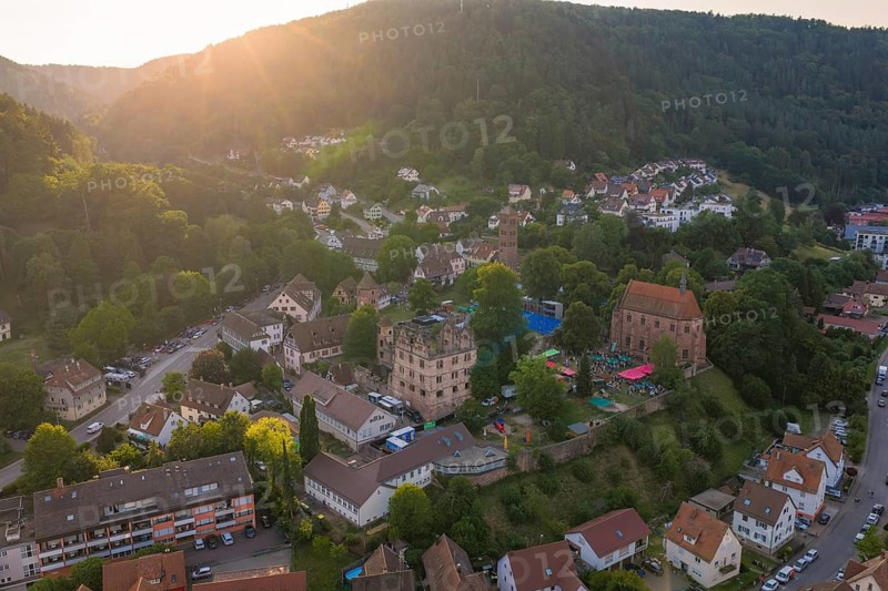 Panoramic view of a village in the evening light, surrounded by forests and hills, Calwer Klostersommer Festival, Hirsau Abbey, Calw, Black Forest, Germany