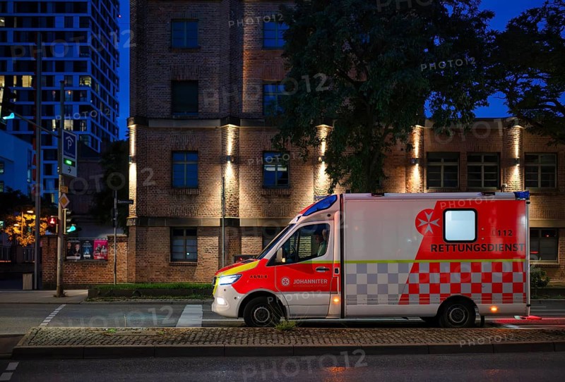 Ambulance RTW Ambulance der Johanniter, logo, waiting at traffic light, Pragsattel, evening, blue hour, Stuttgart, Baden-Württemberg, Germany