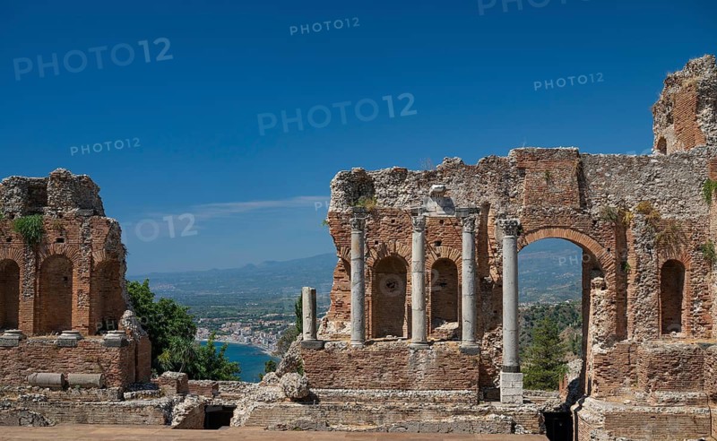 View of ancient theatre, the coast near Naxos and the Mediterranean Sea, Taormina, Sicily, Italy