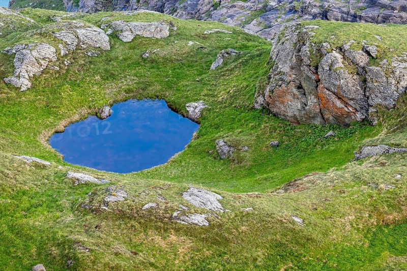 Mountain lake near the Pasterze glacier in the Hohe Tauern National Park, Heiligenblut, Carinthia, Austria