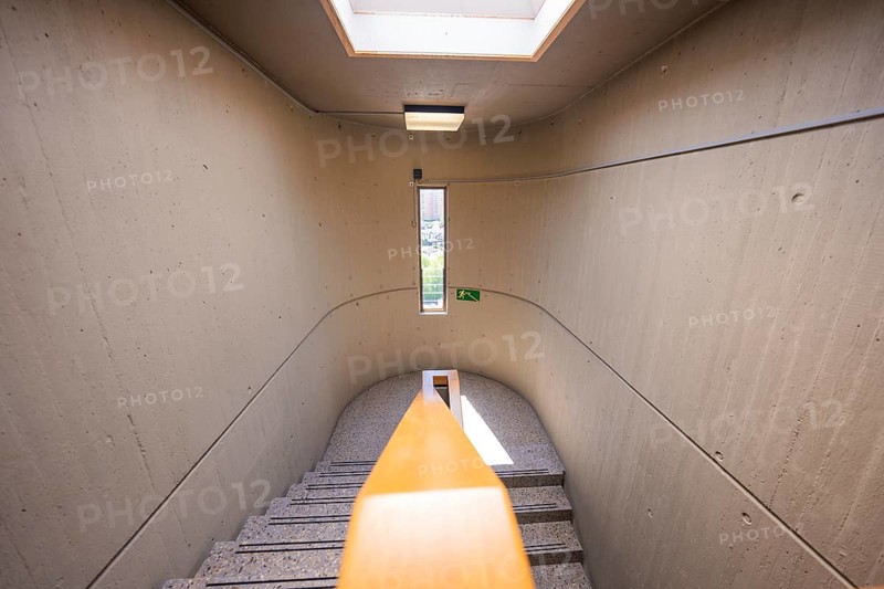 Narrow concrete staircase with skylight and green exit sign, Nagold Hospital of Klinikverbund Südwest, Calw district, Germany