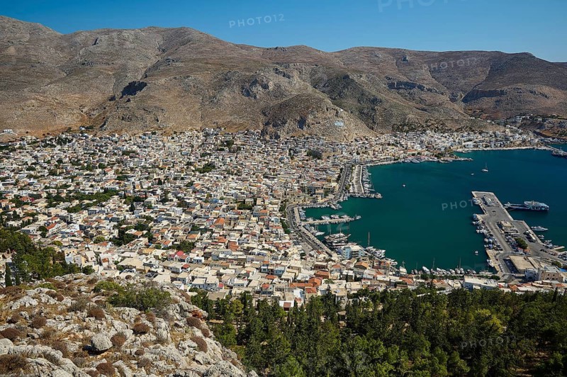Coastal town with densely packed houses and harbor, surrounded by mountains, Pothia, main town, port, Kalymnos, Sponge Diving Island, Dodecanese, Greek Islands, Greece