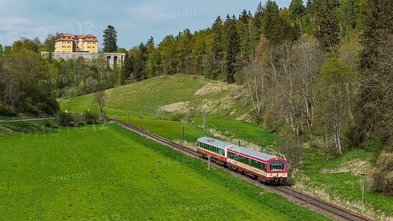 Grafeneck Castle. Killing center during the National Socialist era. Under the direction of Central Service T4, 10, 654 people with disabilities were murdered here. In front of it, a railcar from the SAB Swabian Alb Bahn. Gomadingen, Baden-Württemberg, Germany