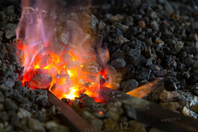 A blacksmith forging, working at the Ehnert forge in Dresden-Bühlau, Saxony, Germany