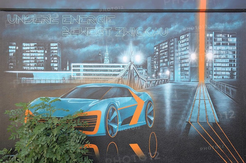 Transformer house with mural inscription our energy moves Zwickau, modern car with cityscape and blue bridge, green plants overgrown, nature, plant growth, progress, night, street lighting, street art, graffiti, symbol, paradise bridge, Zwickau, Saxony, Germany