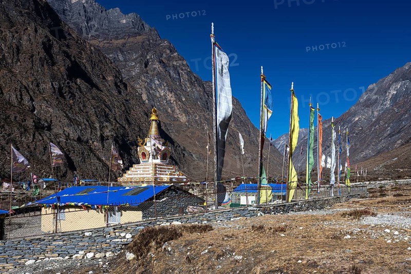 Buddhist stupa, including choirs with prayer flags, Tsum Valley, Himalayas, Nepal