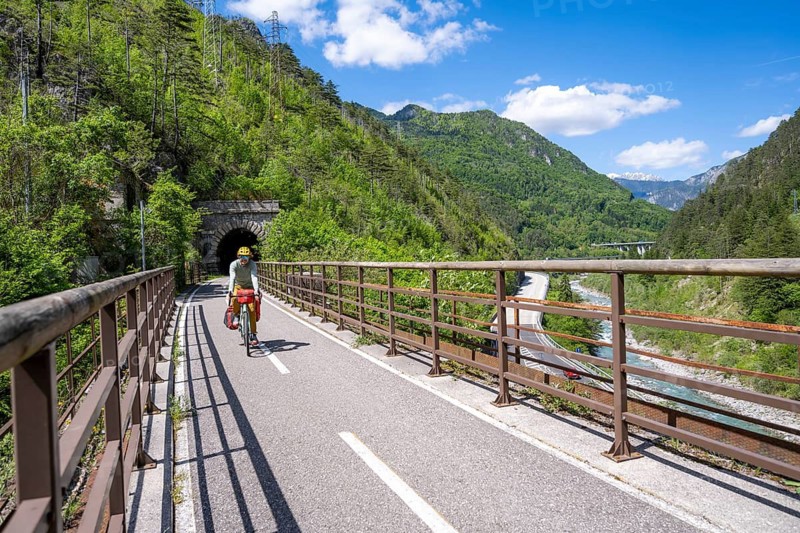 Cyclists with panniers on a cycle path, cycle path along the old Pontebba railway line in the Canal Valley, Alpe-Adria cycle path, bike packing, Friuli-Venezia Giulia, Italy