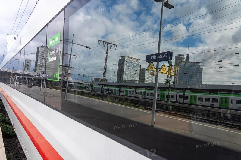 ICE long-distance train in Essen main station, downtown skyline, high-rise office buildings, North Rhine-Westphalia, Germany
