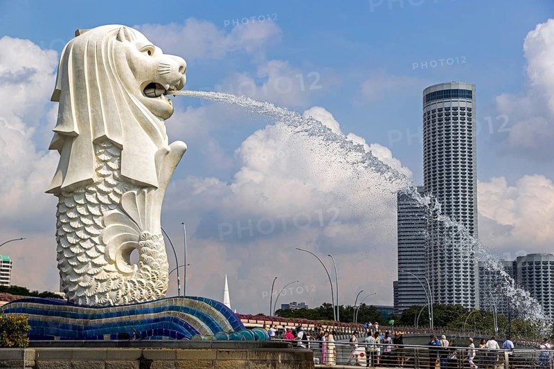 Iconic Merlion fountain spouting water designed with a lion head and fish body at Merlion Park overlooks Marina Bay, Singapore