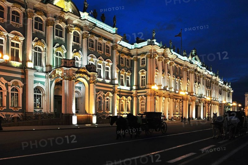 Beautifully illuminated palace at night, two carriages and evening atmosphere, Winter Palace, Hermitage, Saint Petersburg, St. Petersburg, Russia