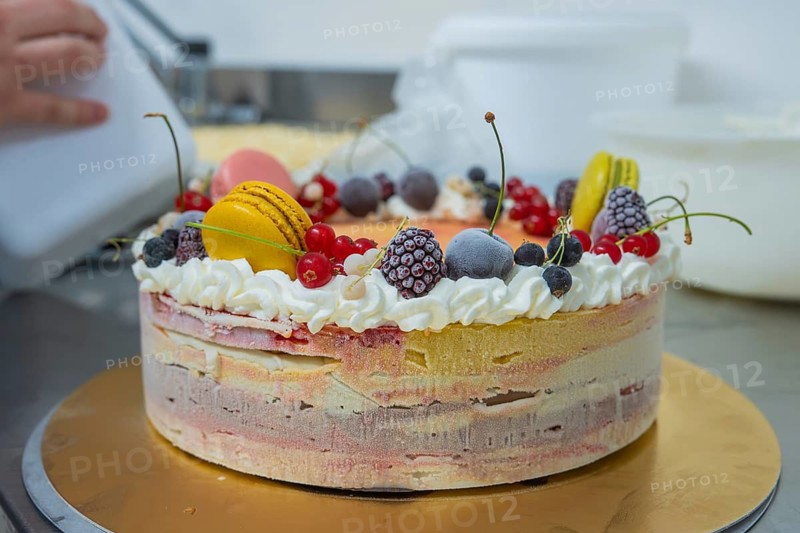 Cake on a table decorated with cream, berries and macarons, ice cream cake, Haselstaller Hof, Gechingen, Calw district, Germany