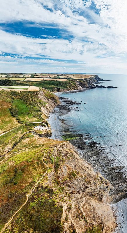 Panorama of Cliffs and Fields over Welcombe Mouth Beach from a drone, North Devon and Cornwall Coastpath Border, Devon, England, Summer 2026