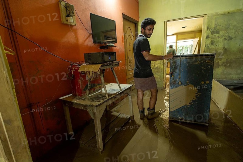 Resident walks around inside his mud-filled and flood-damaged home after floodwaters receded on July 26, 2026 in Sivasagar, India. The flood situation in Assam has improved following the recession of floodwaters. However, more than 700, 000 people across 21 districts have been affected by the floods, while the state's death toll has risen to 60
